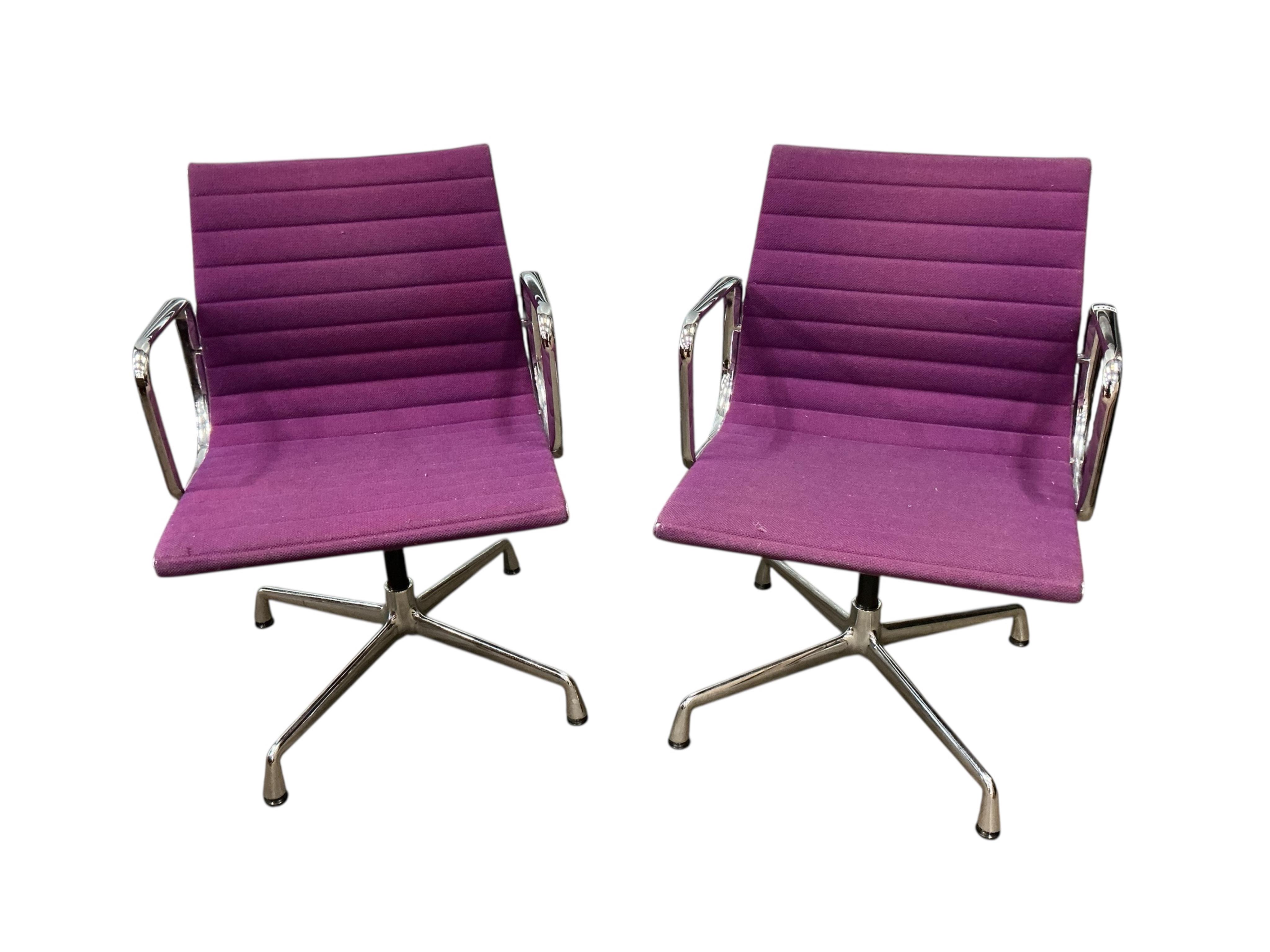 Charles Eames for Vitra, a pair of chrome swivel desk chairs on four prong bases, width 57cm, depth 50cm, height 82cm